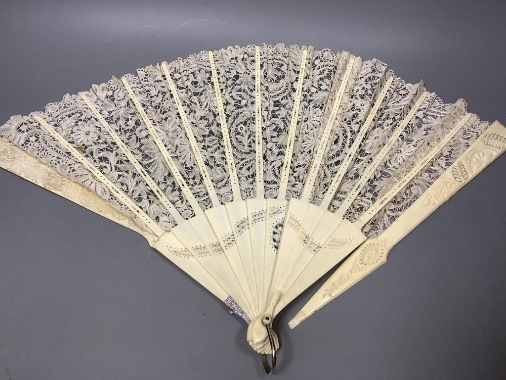 A Brussels lace and ivory fan and four fans